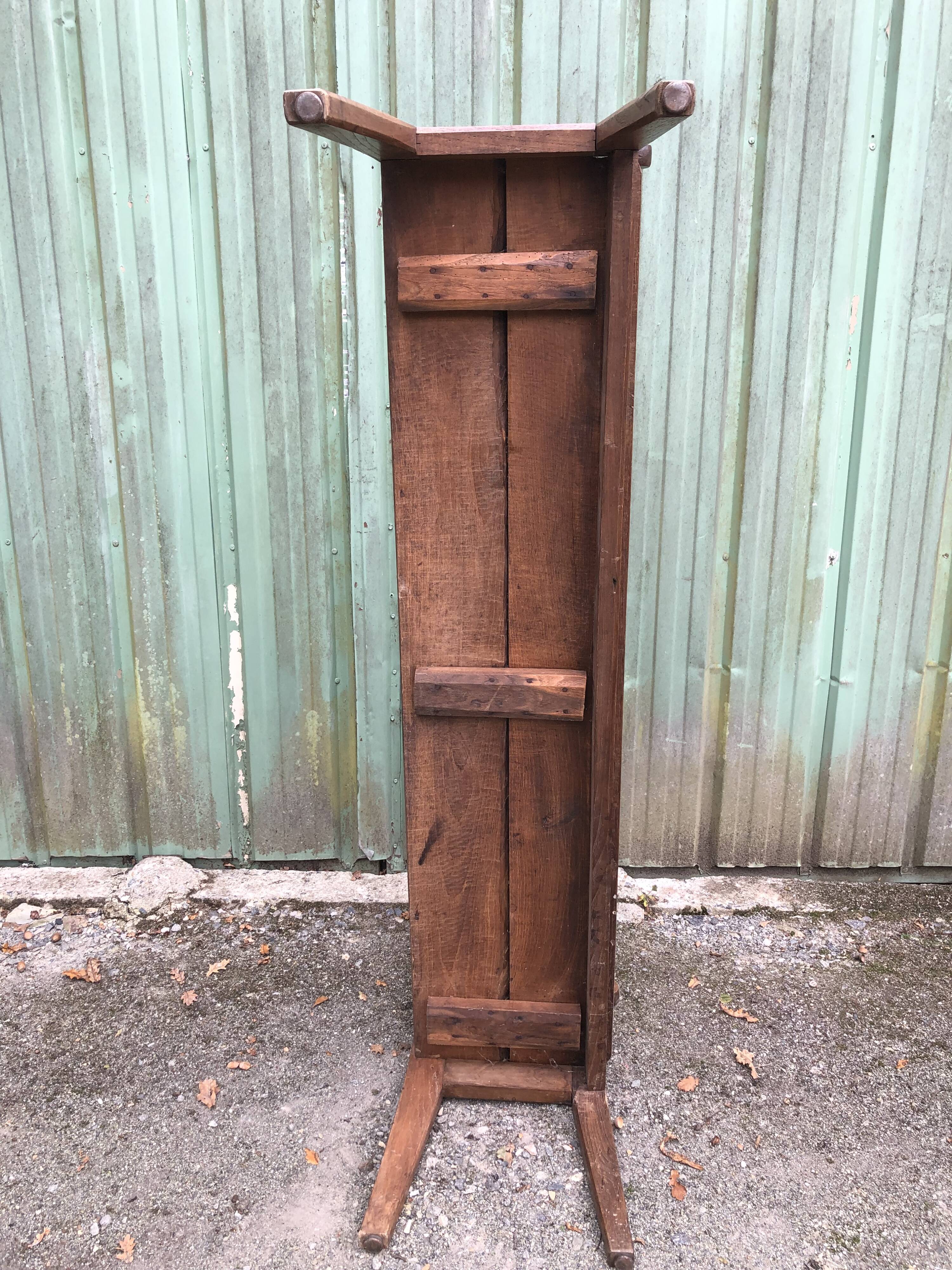 Duo of old solid oak benches with backs and armrests.