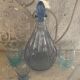 Liquor service consisting of a blue glass decanter and. 3 small antique glasses