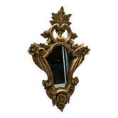 Wooden mirror with gilded stucco