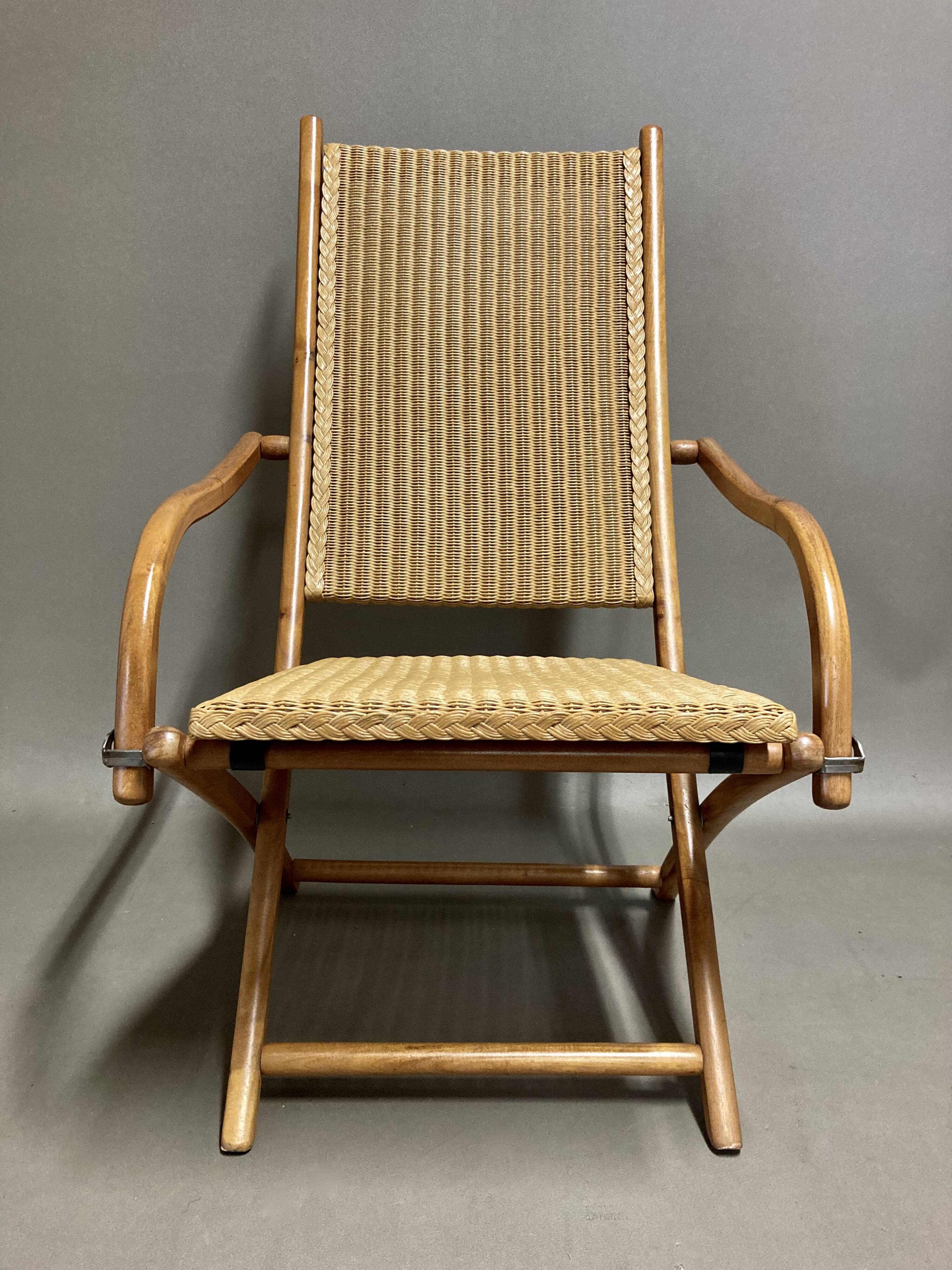 Foldable rattan armchair design 1960.