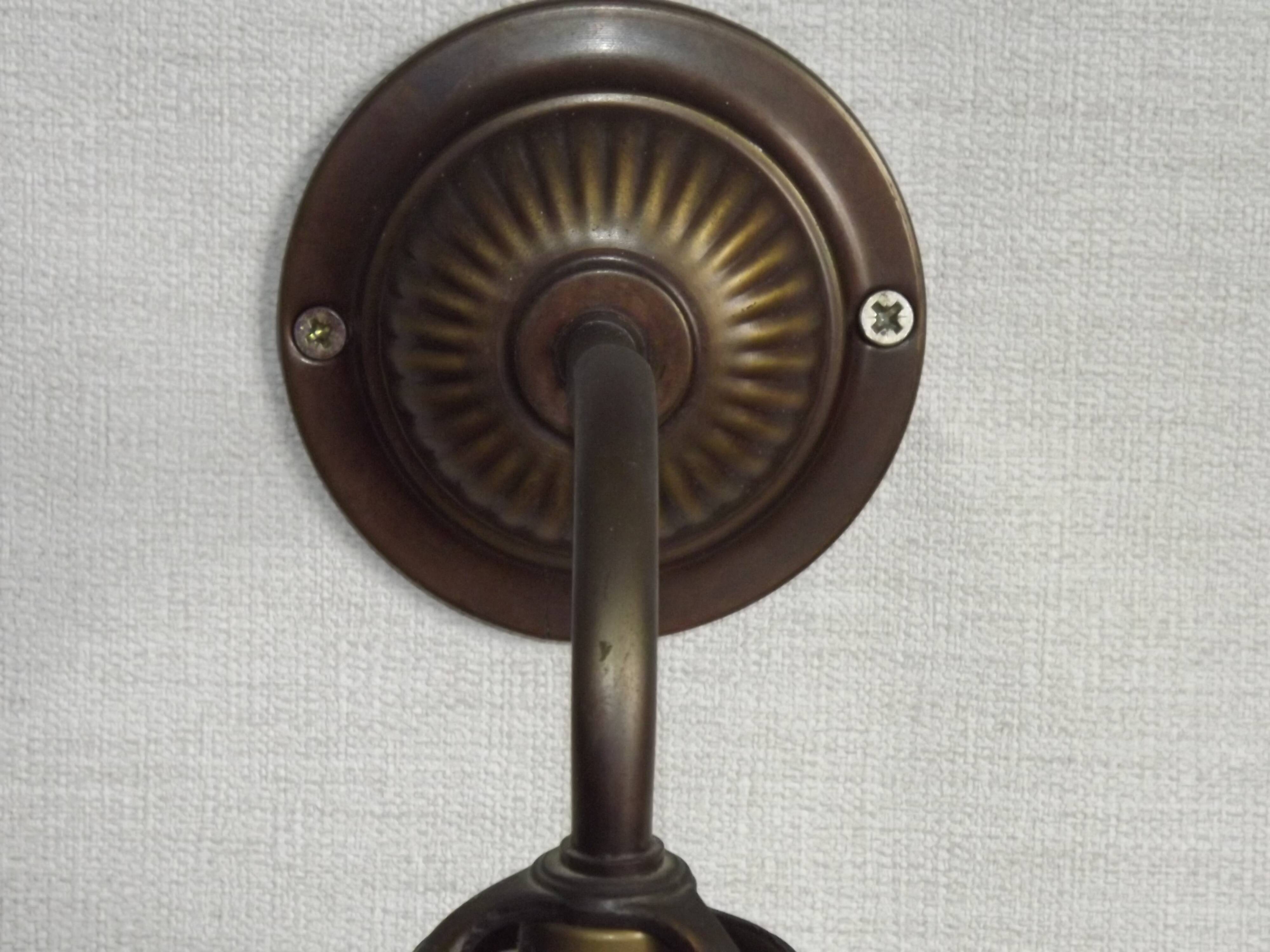 French vintage bronze effect single wall light with opaque beaded glass shade.