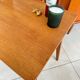 Old wooden desk or side table with compass legs