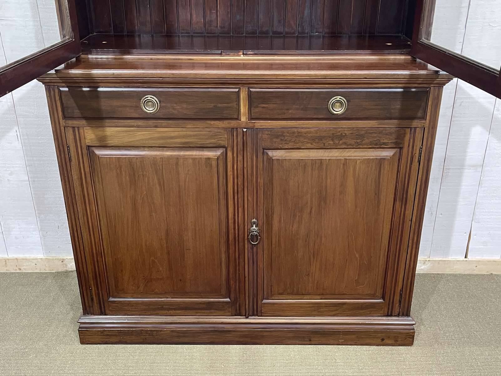 English walnut two-body library from the early 20th century.