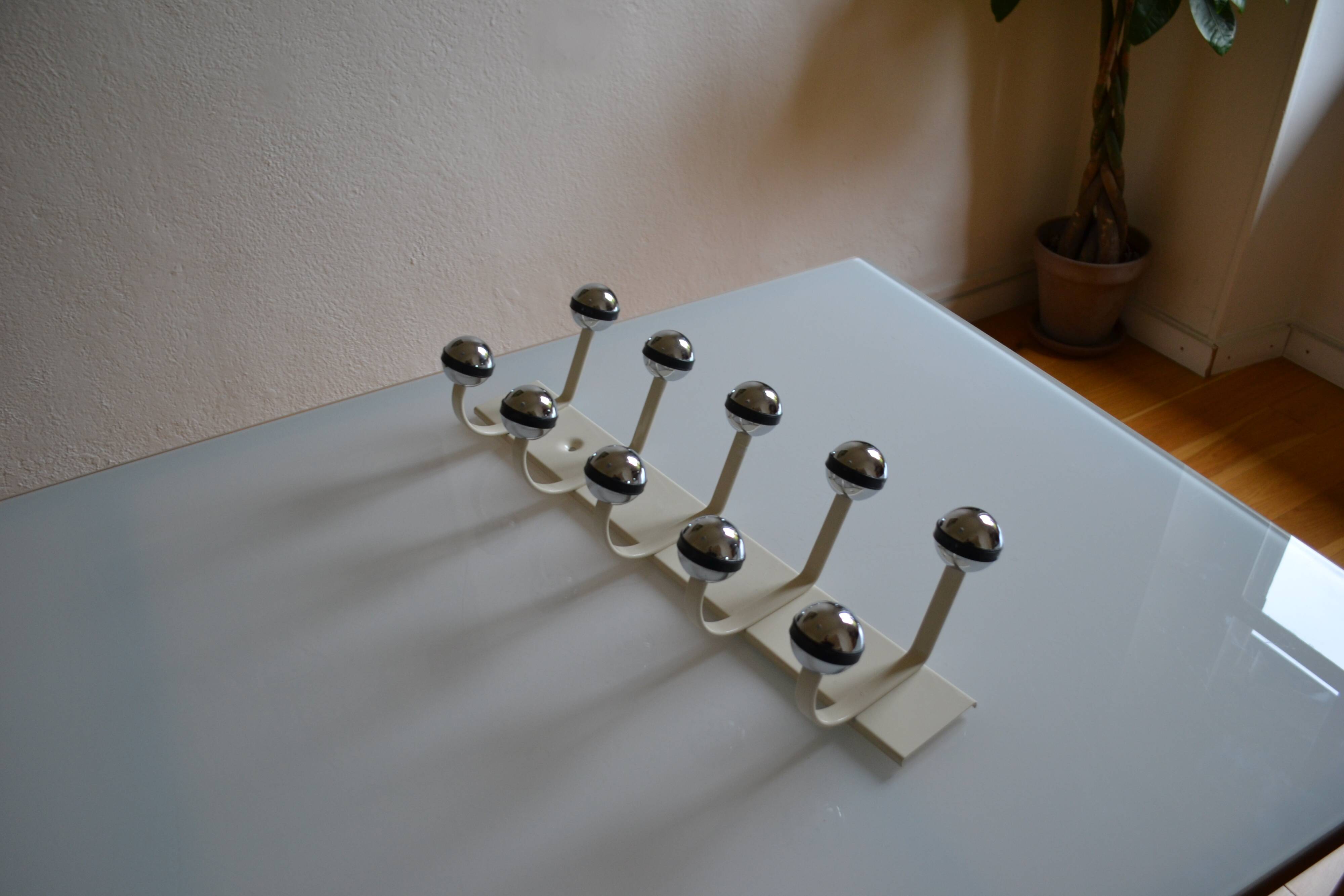 Vintage 1970s wall-mounted coat rack with 10 hooks