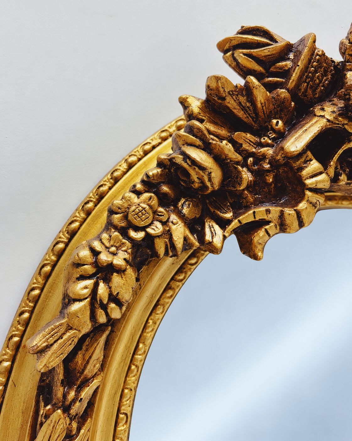 Large gold full-length mirror with ornate crest