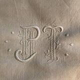 Antique embroidered linen-cotton sheet with monogram PJ T and Venice lace pattern
