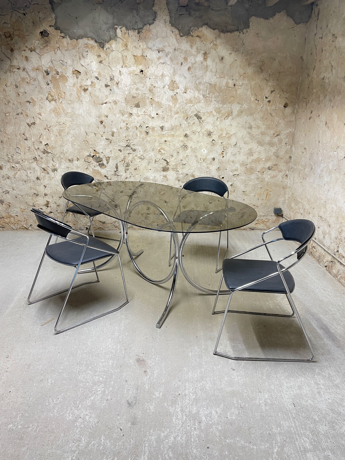 Smoked glass oval table from the 1970s.