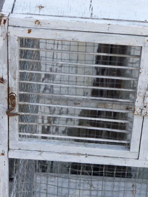 Vintage bird cage, made of wood and chicken wire metal square mesh