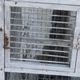 Vintage bird cage, made of wood and chicken wire metal square mesh