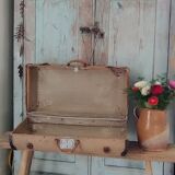 Old suitcase in canvas, wood and metal