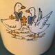 Enamelled milk jar retro style ecru color with "goose" patterns. Wooden handle.