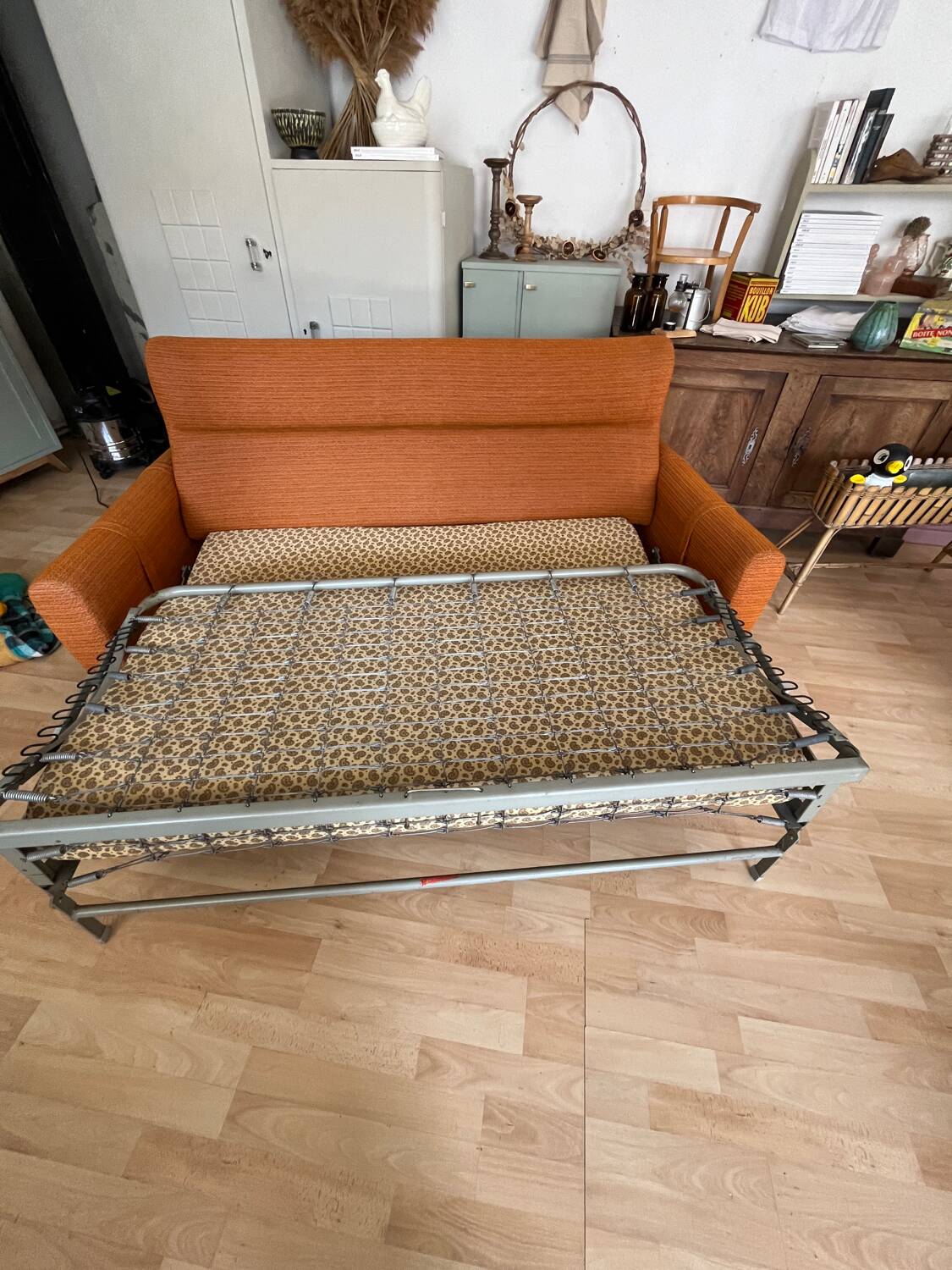 Vintage orange convertible sofa