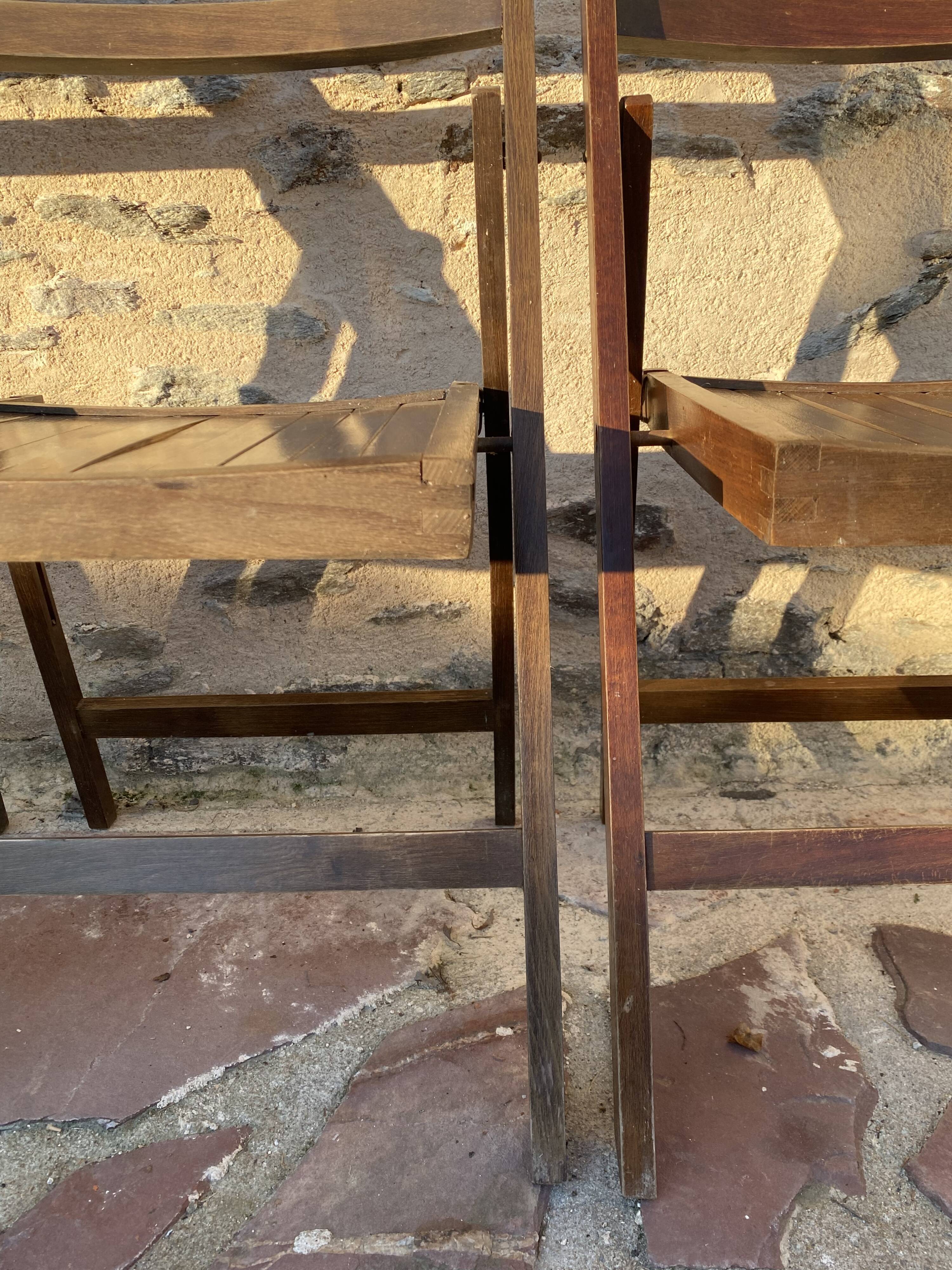 Three wooden folding chairs