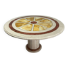 Round travertine diningtable with yellow marble and brass inlay