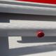 White mado buffet, red handles and tray, hen grill