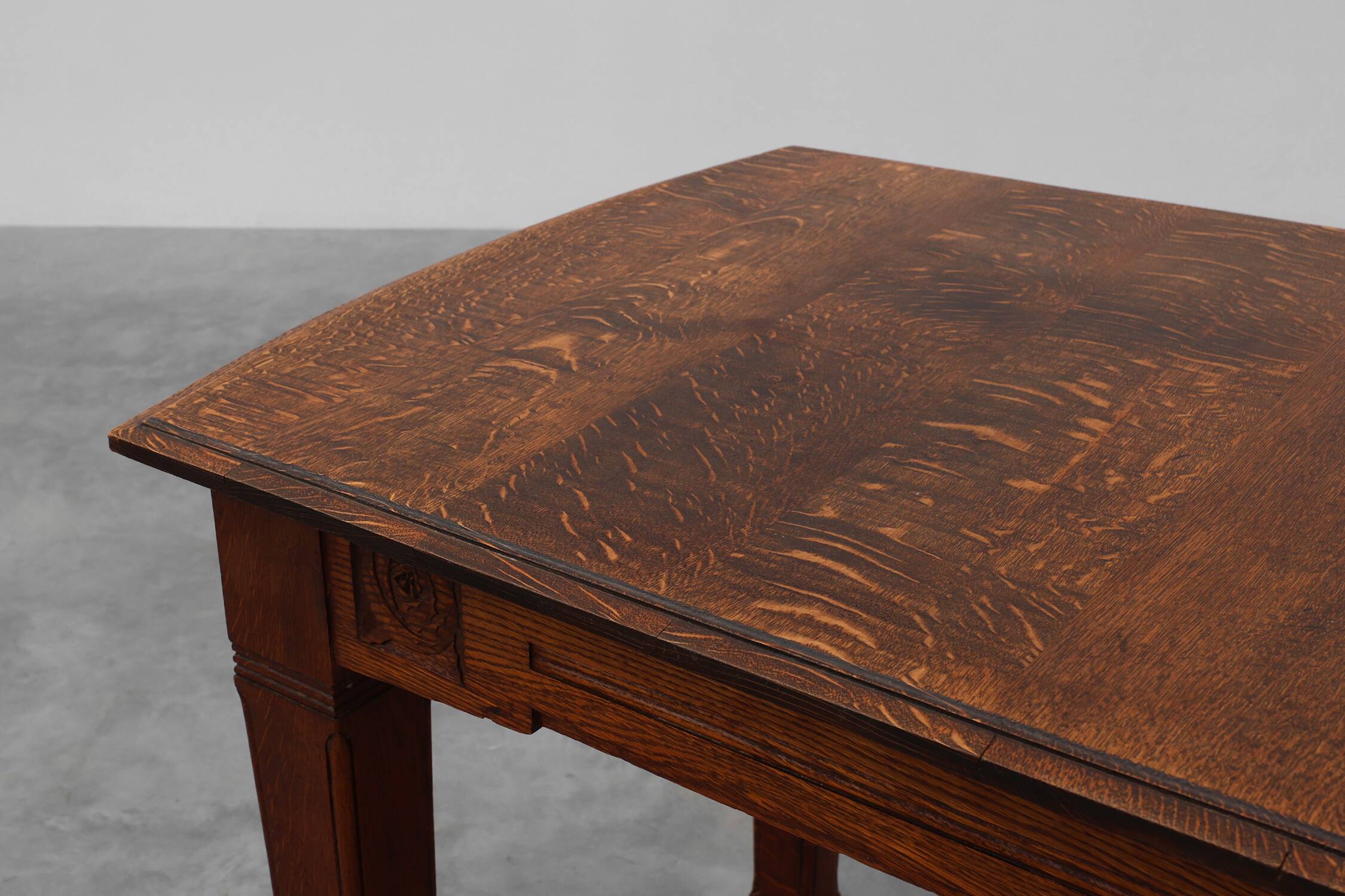 Oak Art Deco dining table with carved frieze, France 1920s