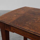 Oak Art Deco dining table with carved frieze, France 1920s