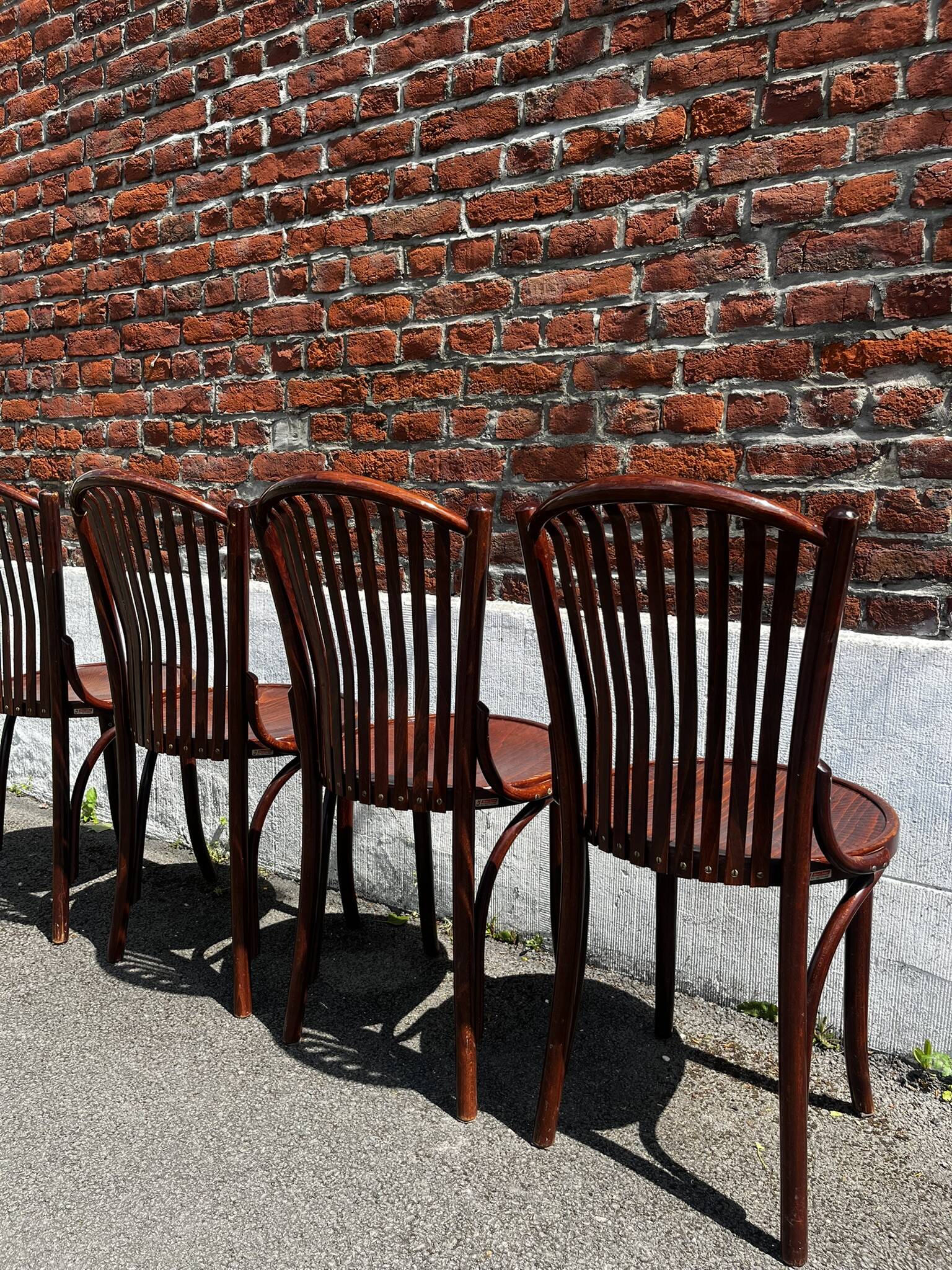 Lot of 4 vintage bistro chairs with slats in Thonet style.