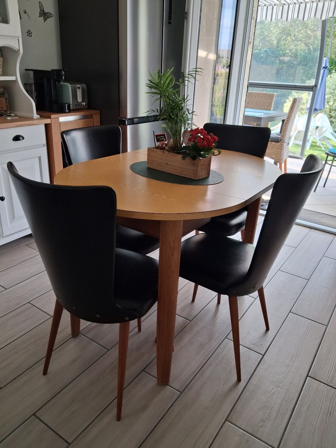 4 black Baumann style chairs