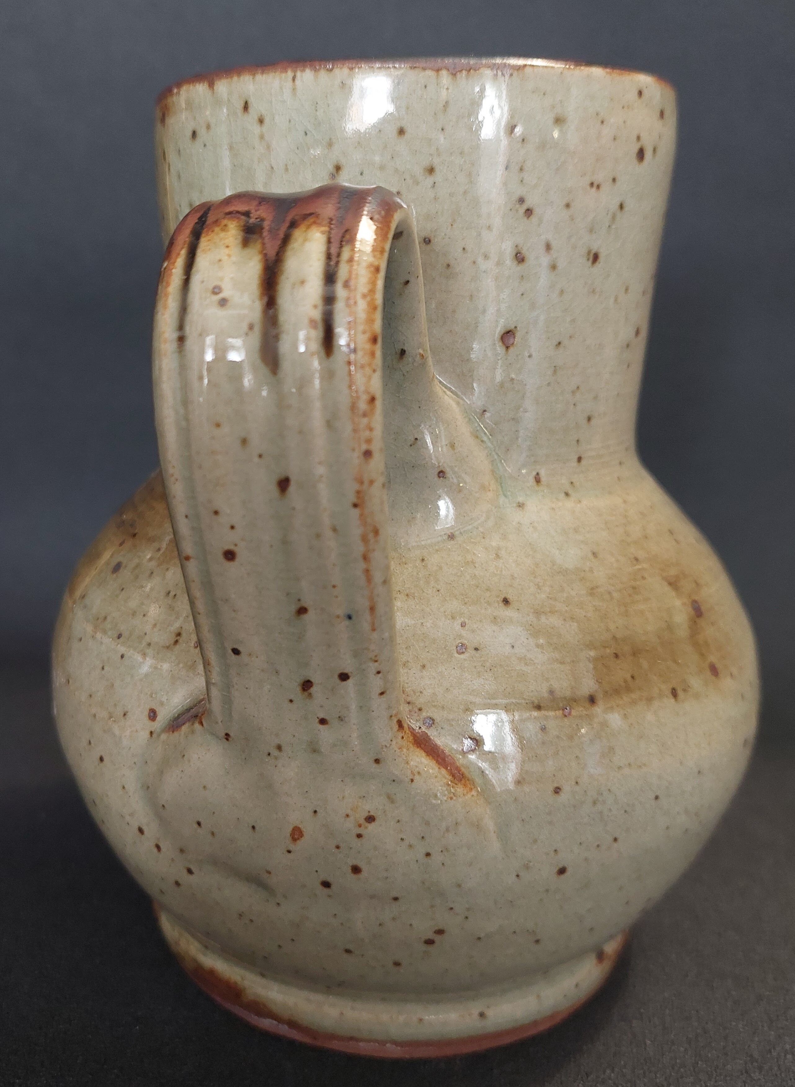 Glazed terracotta pitcher from the 20th century.