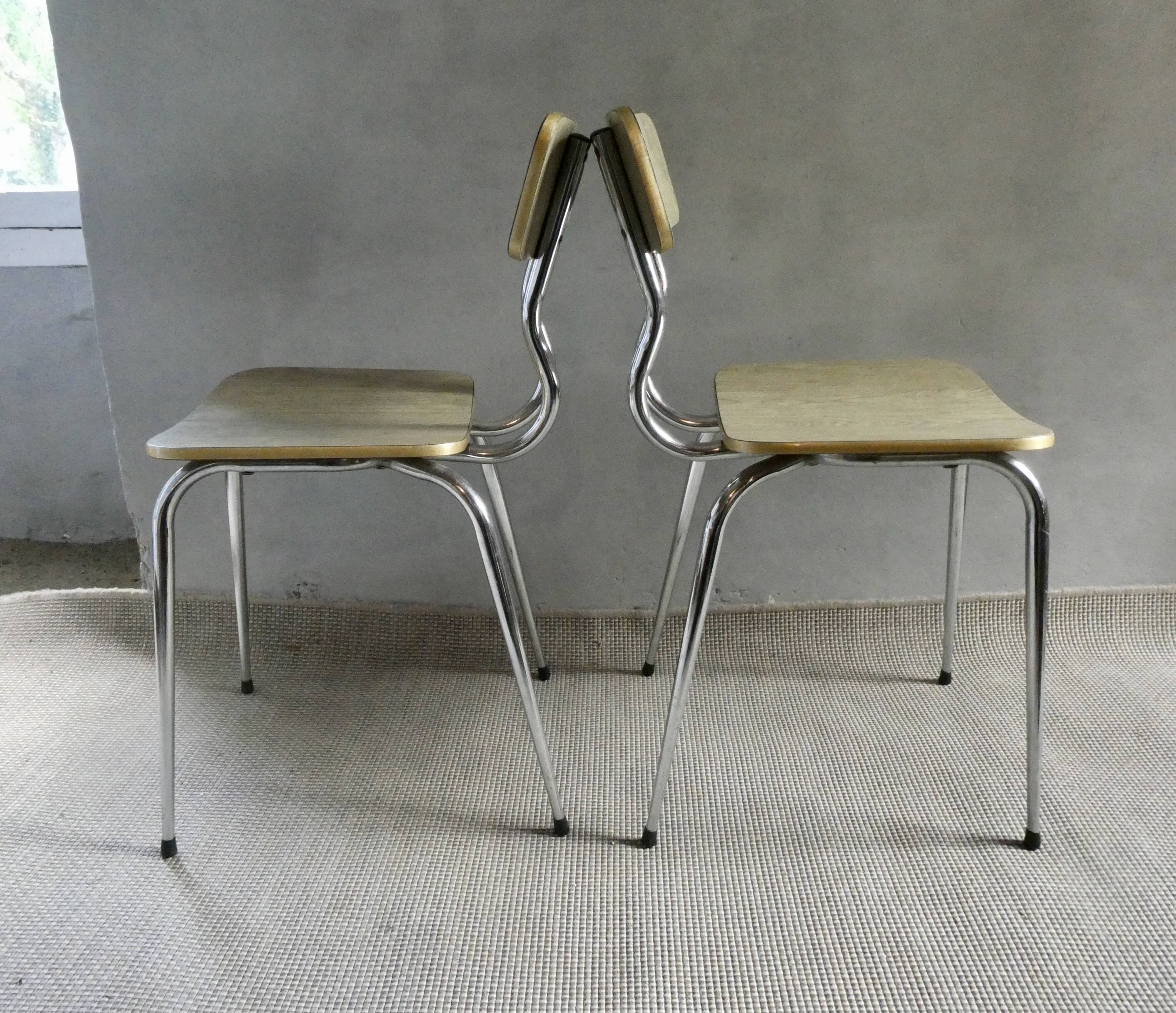 Pair of chairs in "wood" formica and gold edges, 1960s