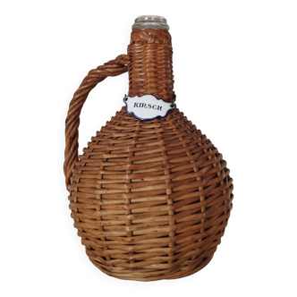 Petite dame-jeanne en verre, enveloppe osier tressé, étiquette émail Kirsch