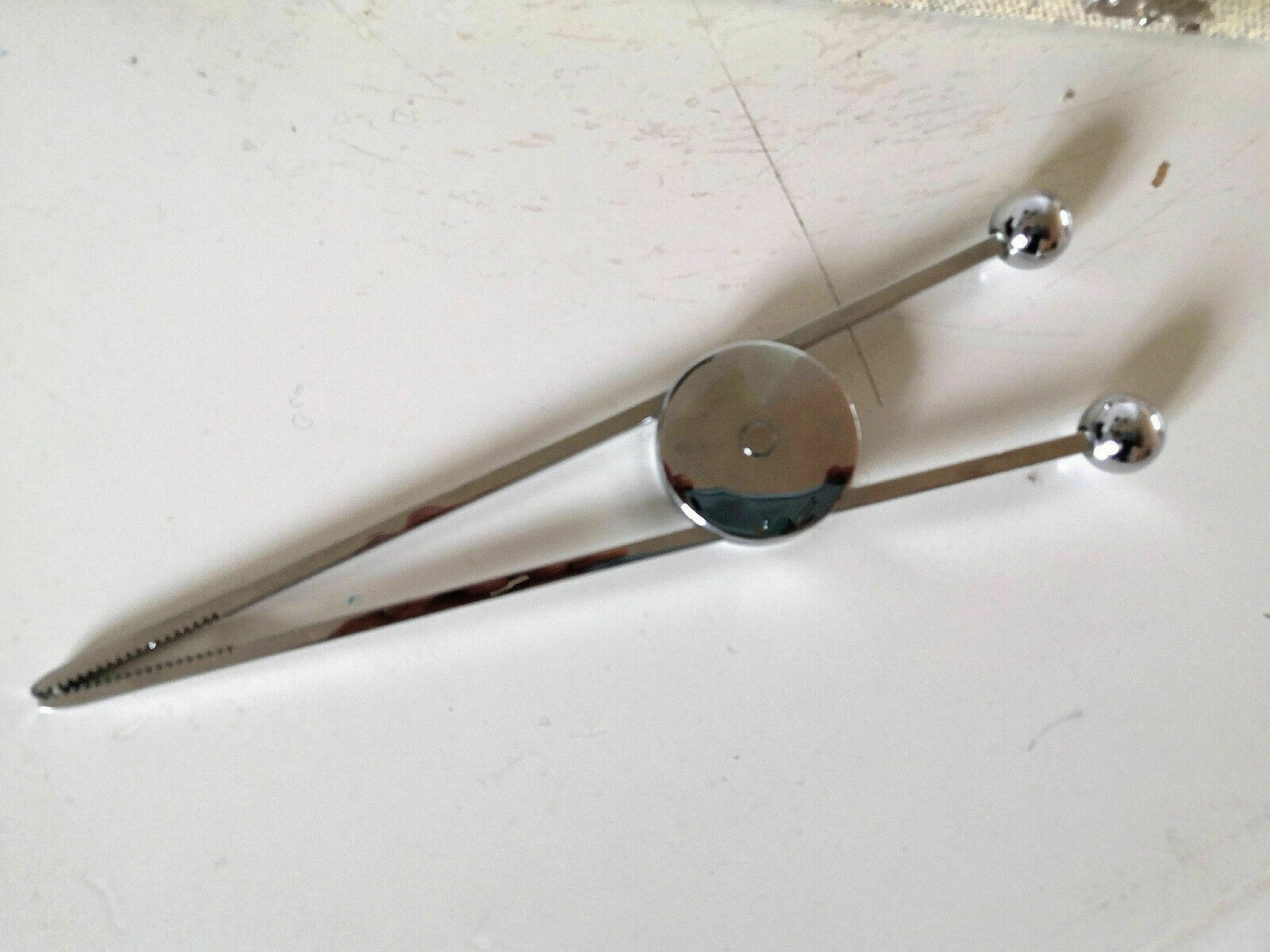 Ice pliers and ice hammer by Jacques Adnet