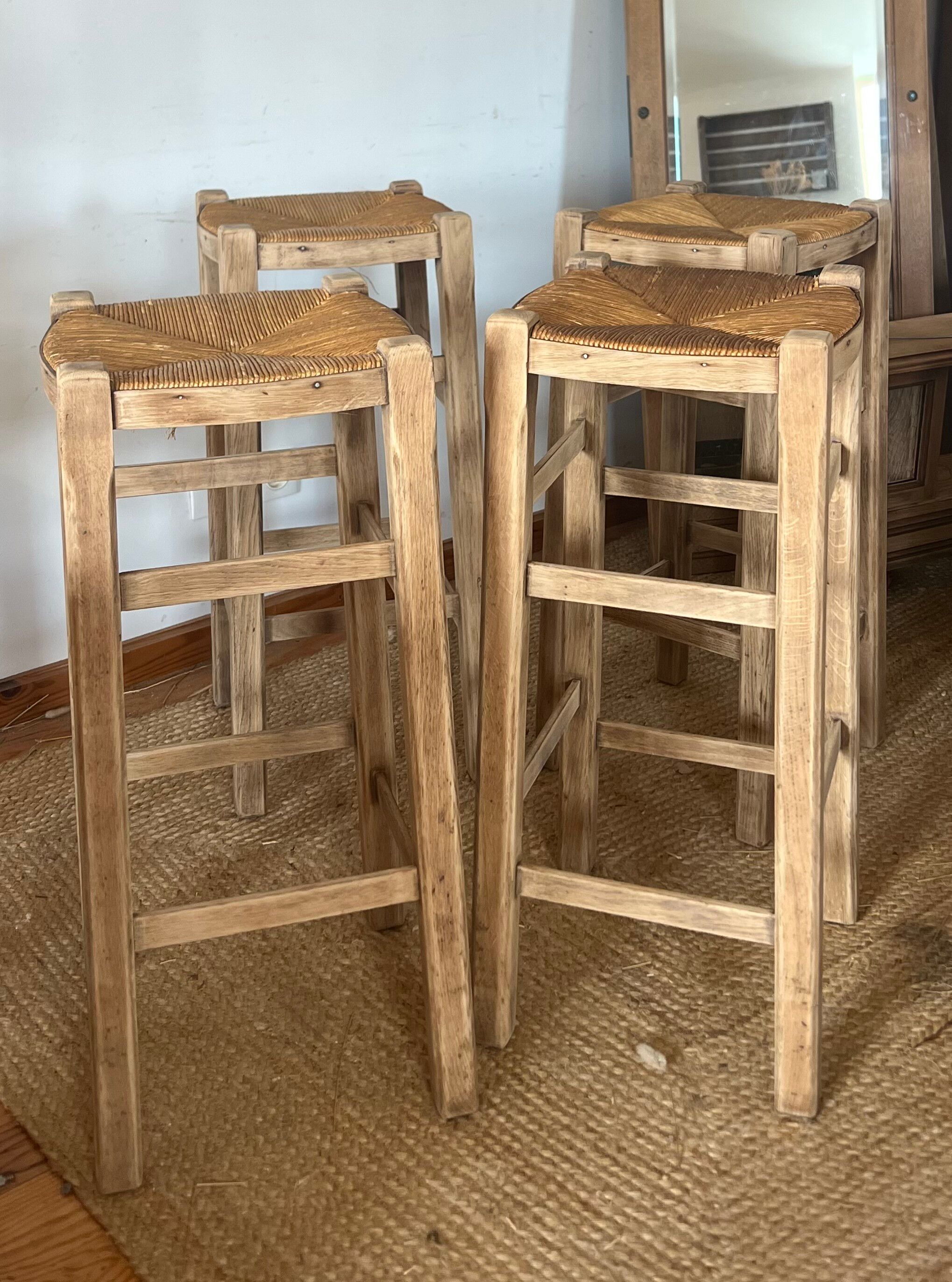 Set of 4 vintage high bar stools in raw solid oak and straw.