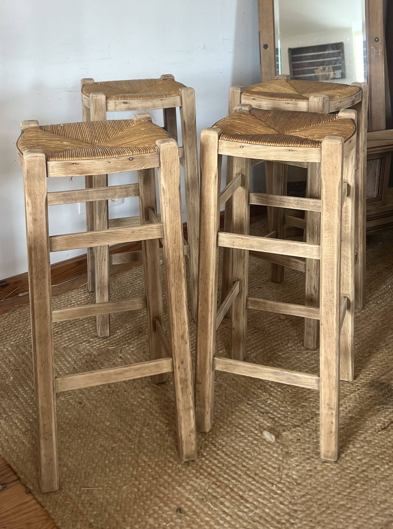 Set of 4 vintage high bar stools in raw solid oak and straw.