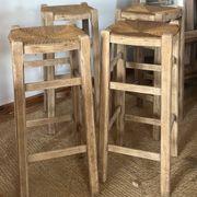 Set of 4 vintage high bar stools in raw solid oak and straw.