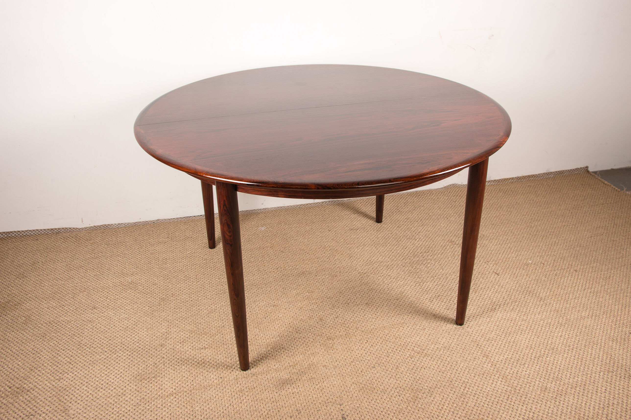 Danish extendable dining table in Rio Rosewood model 55 by Arne Vodder for Sibast 1958.