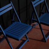 Set of two blue folding chairs