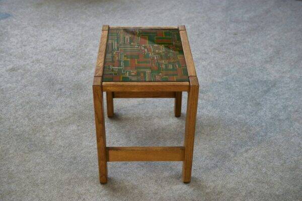 Solid oak side table with fabric decoration top