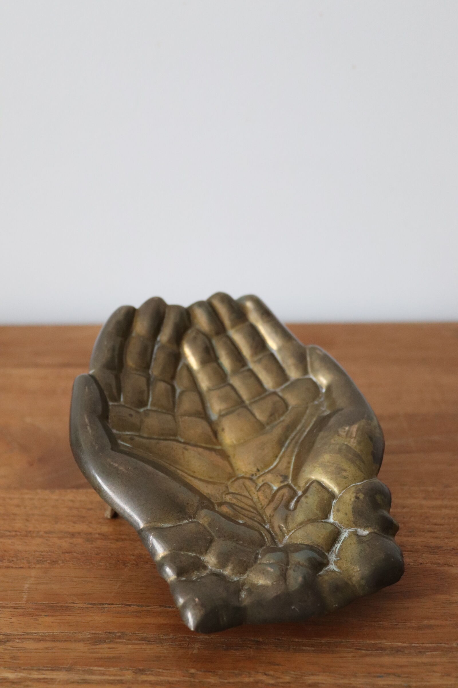 Empty pocket pair hand lucky charm brass