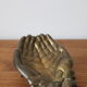 Empty pocket pair hand lucky charm brass