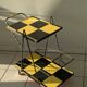 Vintage black and yellow checkered rolling bar trolley