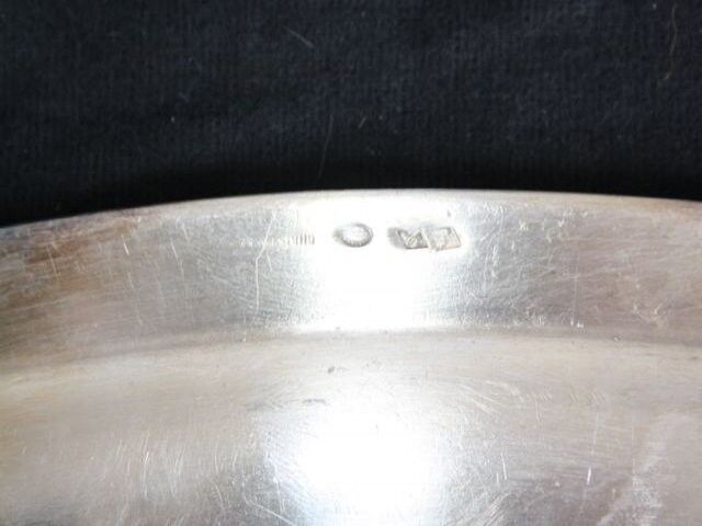 Flat oval silver metal