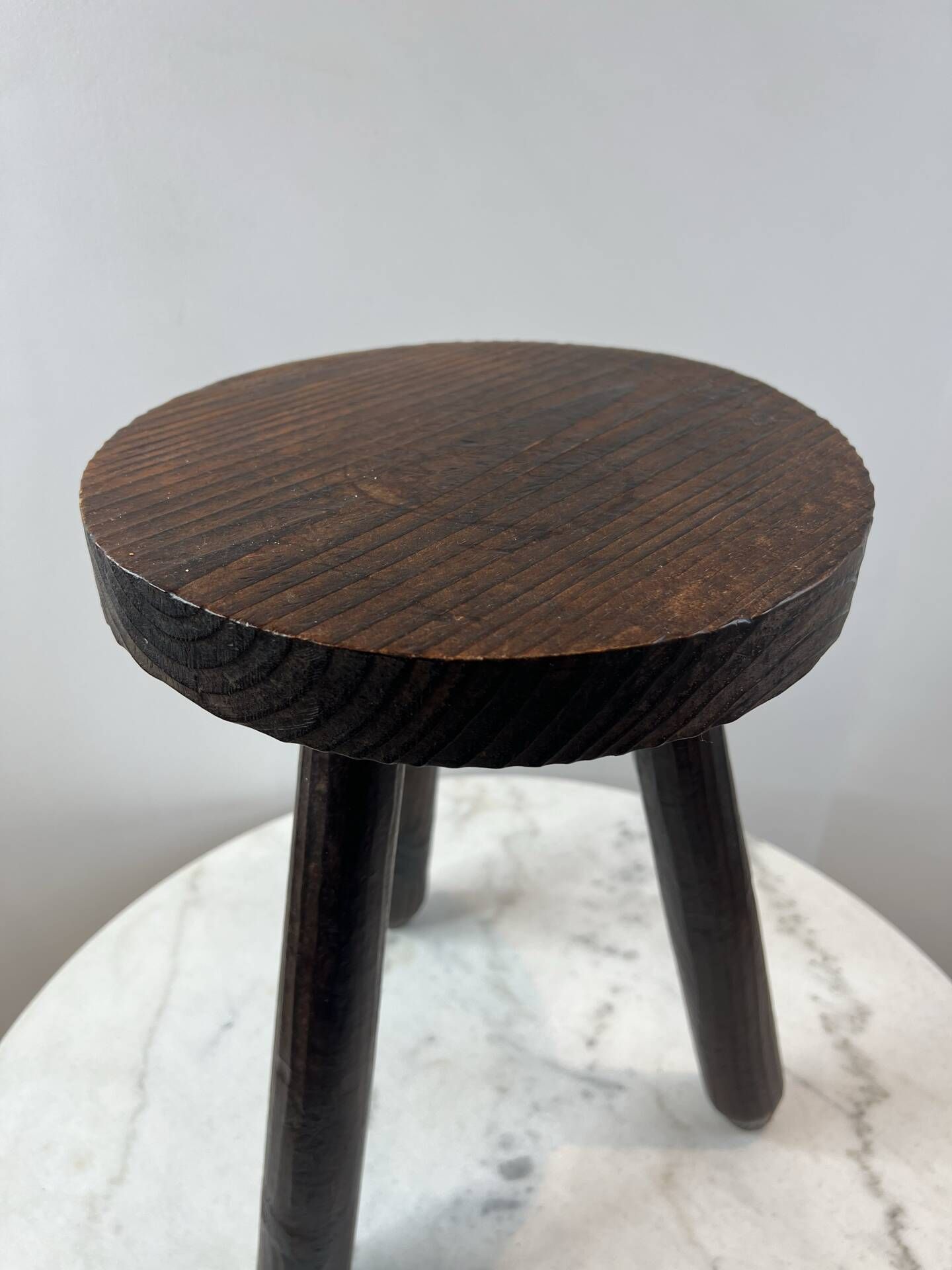 Tripod stool in turned, patinated wood