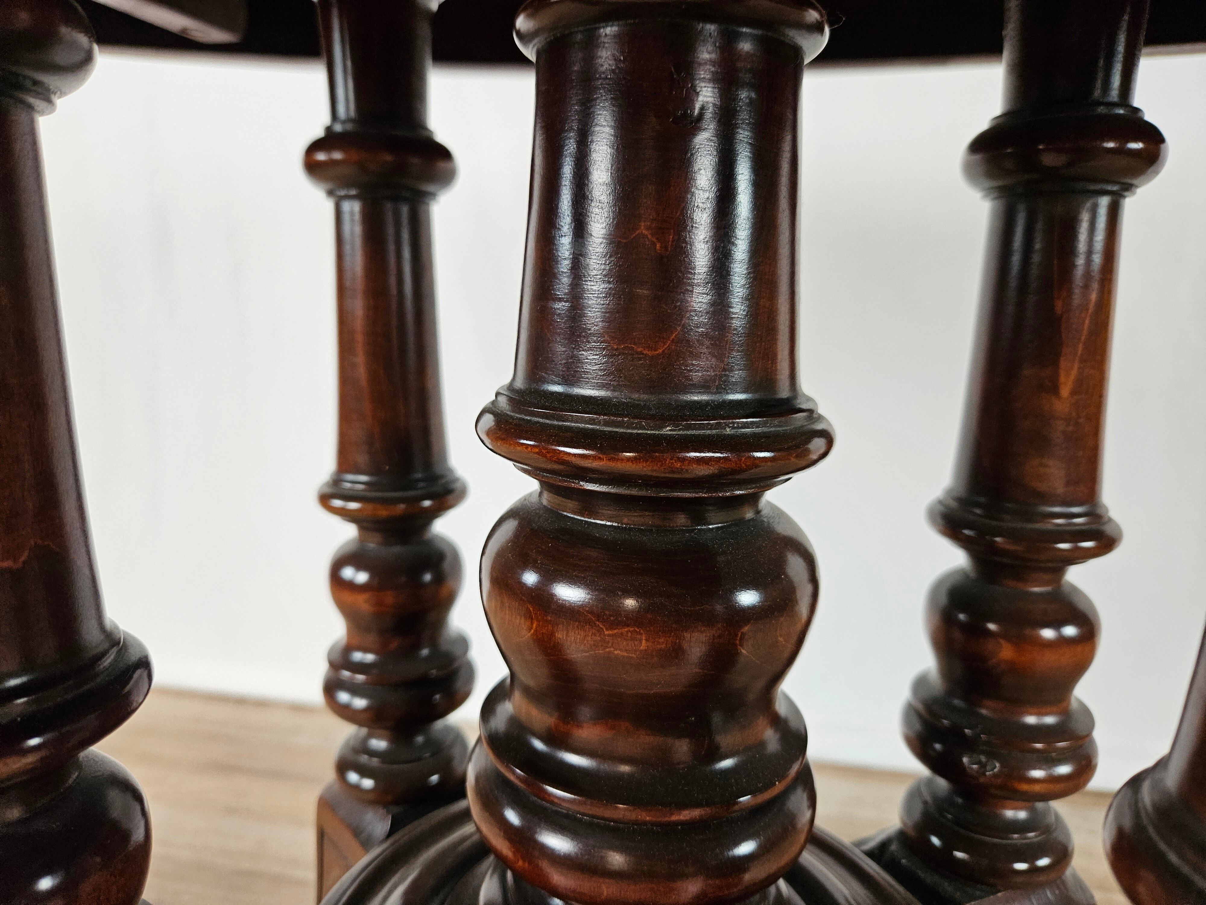 Coffee table in walnut with maple inlays and wheels