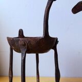 Zoomorphic wrought iron pocket emptier