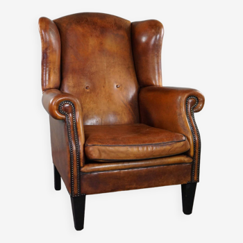 Lovely large sheepskin leather wingback armchair with very good seating comfort