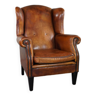 Lovely large sheepskin leather wingback armchair with very good seating comfort