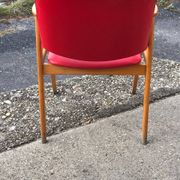 Red office chair in faux leather and wood, Mid-Century style (1960s)