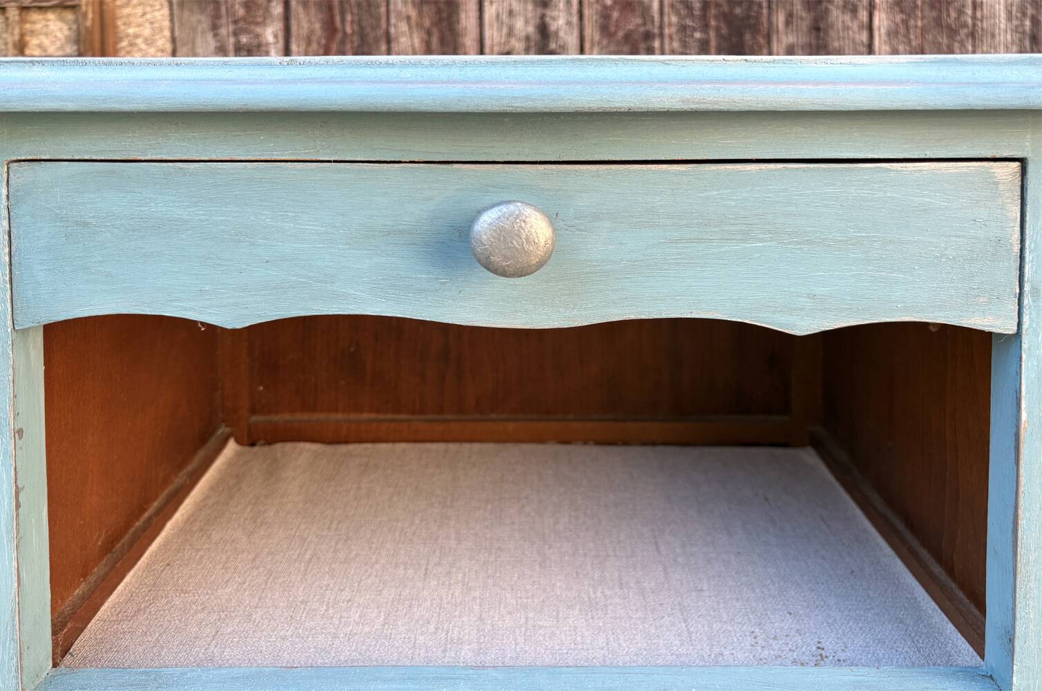 Pair of patinated lagoon blue bedside tables, early 20th century, with curved legs.