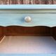 Pair of patinated lagoon blue bedside tables, early 20th century, with curved legs.