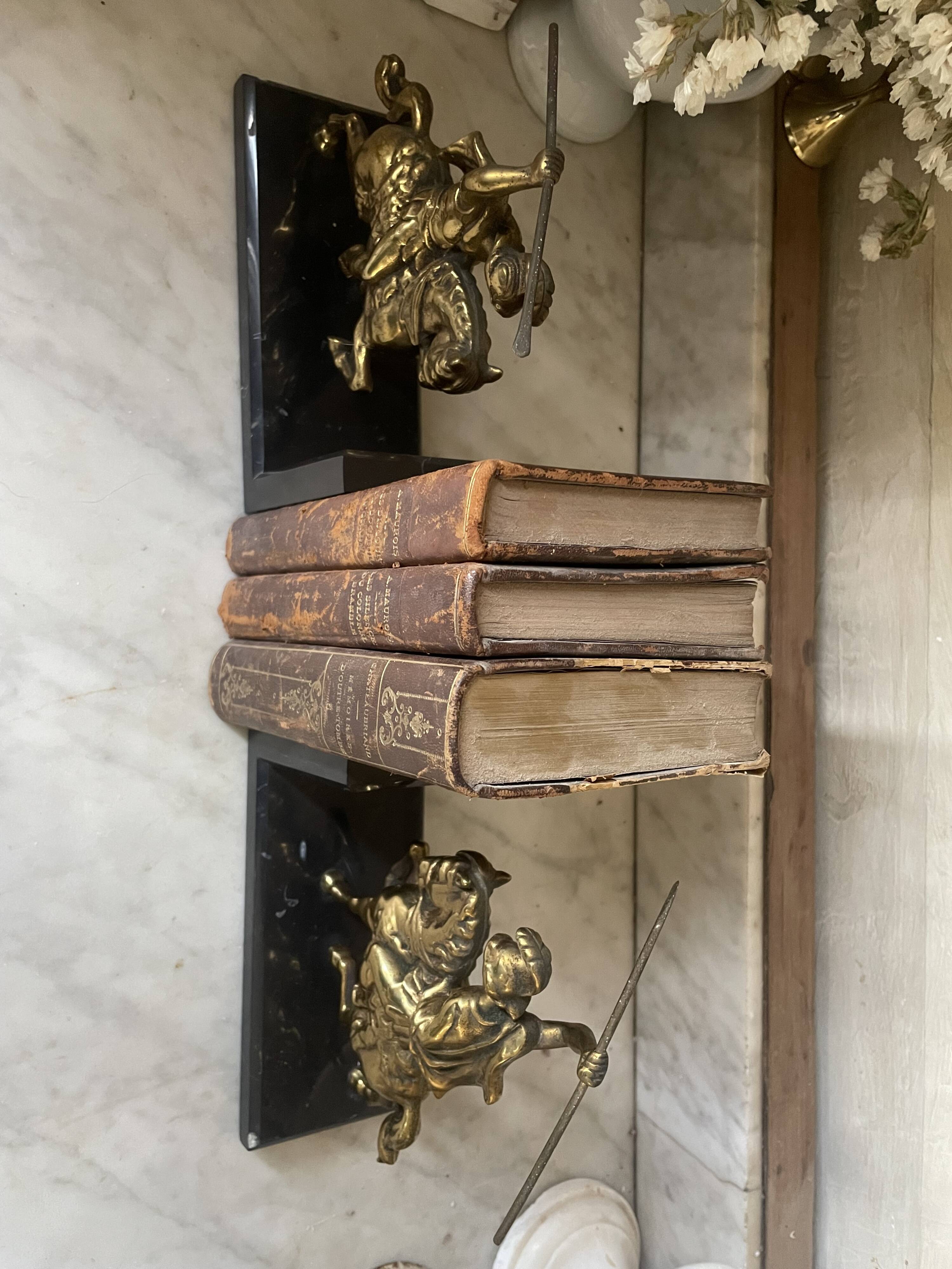 Pair of neo-classical Roman soldier bookends in marble and brass.