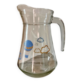 Glass pitcher with cloud decoration