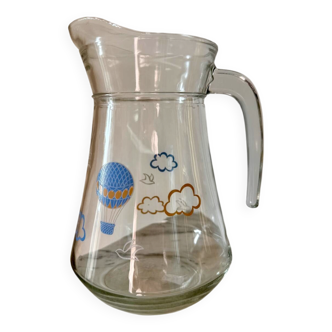 Glass pitcher with cloud decoration