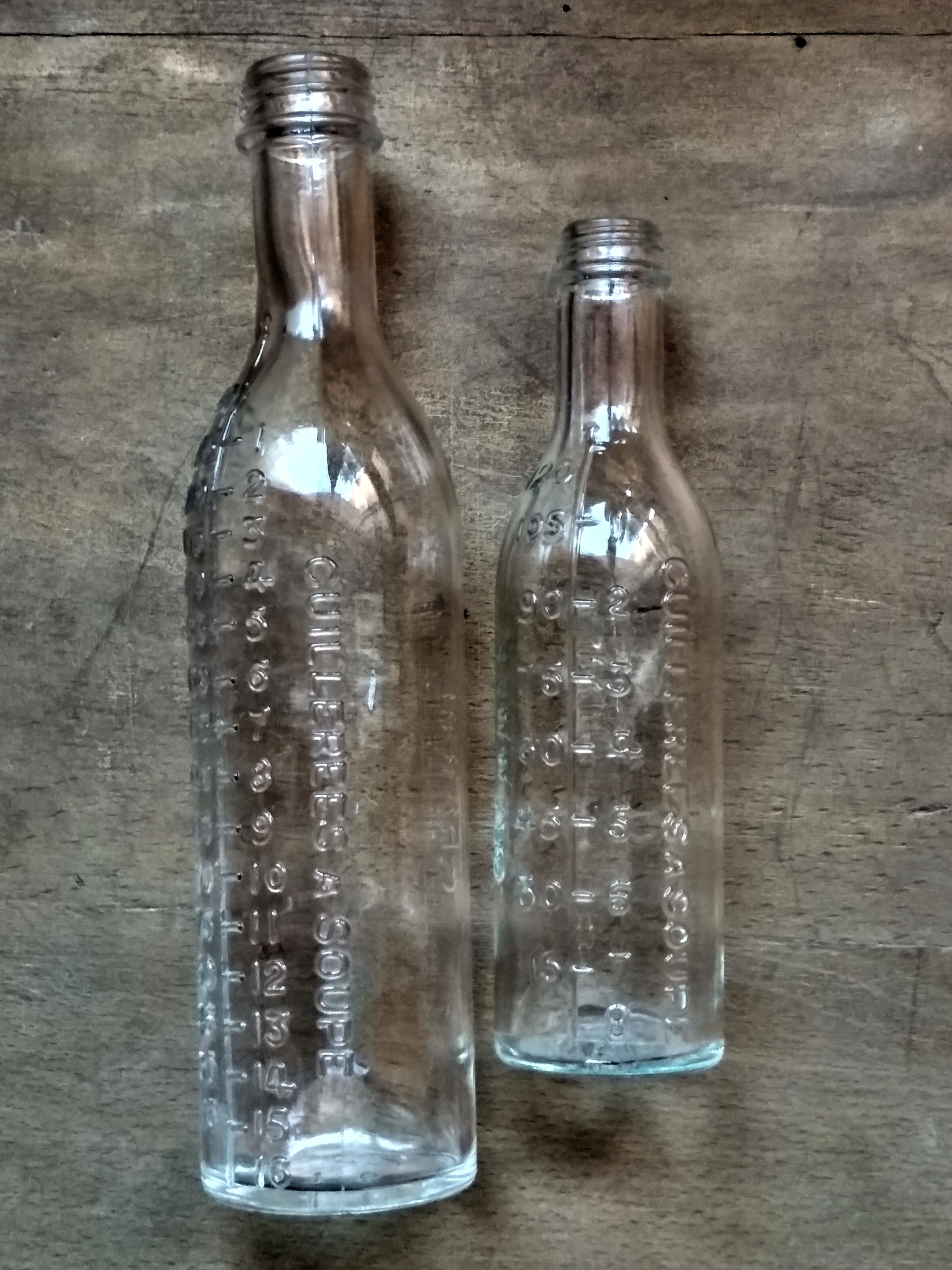 2 old graduated pharmacy bottles