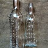 2 old graduated pharmacy bottles